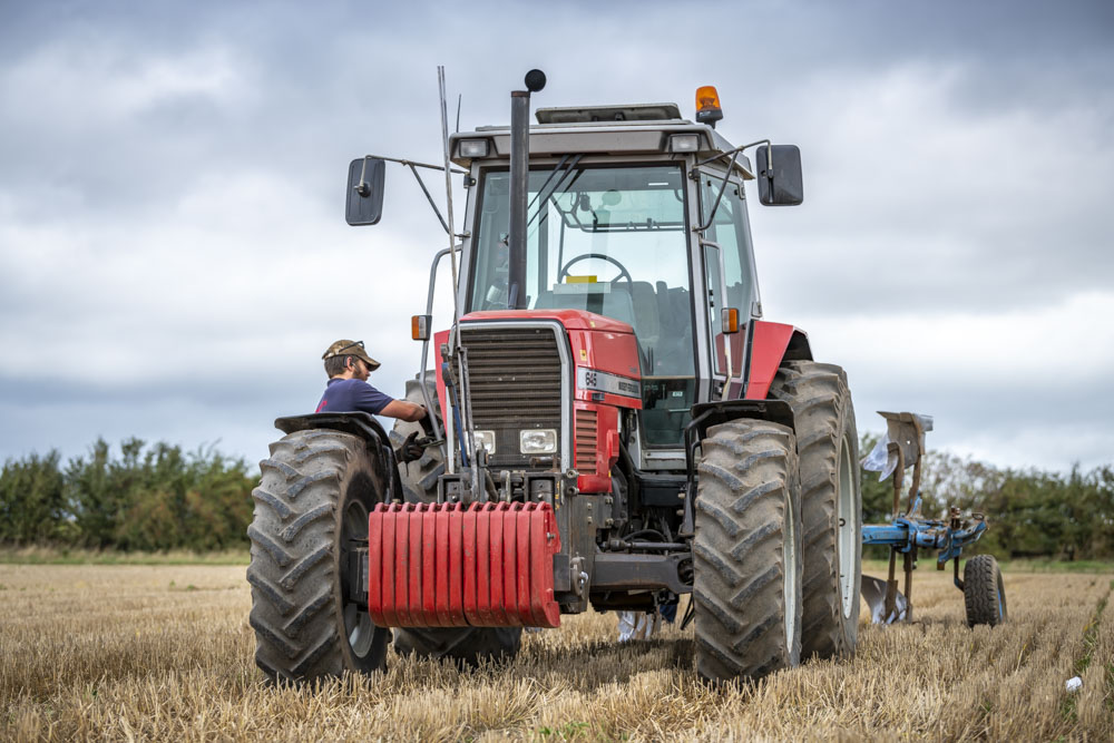 Massey Ferguson ploughing, low angle